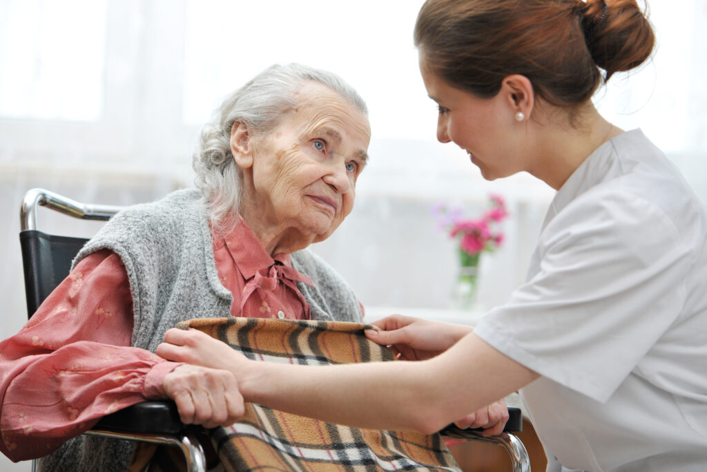 Female Nurse Is Taking Care Of The Senior Woman